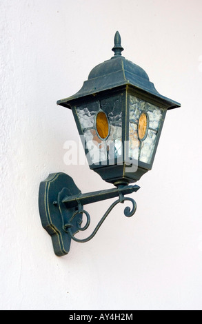 Outdoor, old style lamp, mounted on the wall. Stock Photo