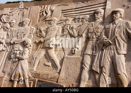 Bas Reliefs around the base of the Famous Memorial to the People's Heroes, Huangpu Park on the Bund in Shanghai,China Stock Photo