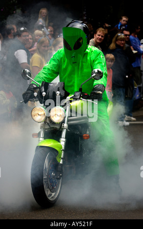 Man in alien costume on motorcycle Alien Daze Parade McMinnville Oregon 2004 Stock Photo