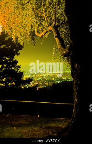 Buildings of downtown Portland illuminated at dusk as viewed from the early 20th century Pittock mansion Oregon USA Stock Photo