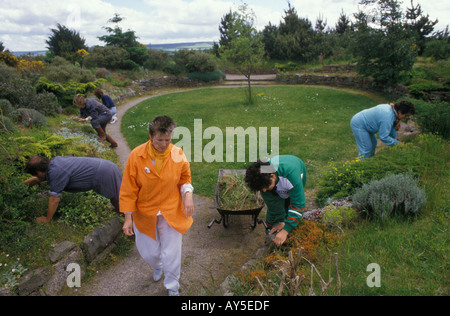Findhorn Community Foundation, Moray, Scotland. Members of the eco village community work in the gardens 1970s UK HOMER SYKES Stock Photo