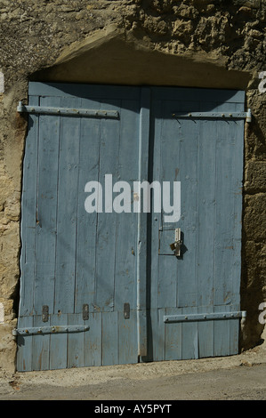 Weathered Blue Door in the Sun of Provence Stock Photo