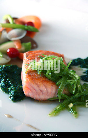 Grilled salmon steak with julienne vegetables. Stock Photo