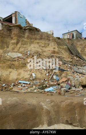 The beach at Happisburgh Norfolk with houses that have fallen into the ...