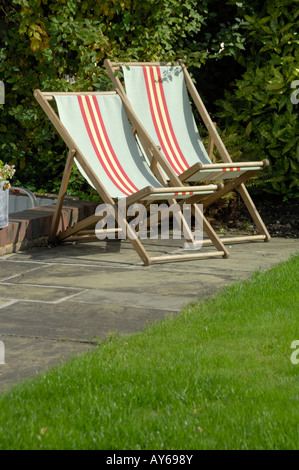 Two folding deck chairs in sun Stock Photo