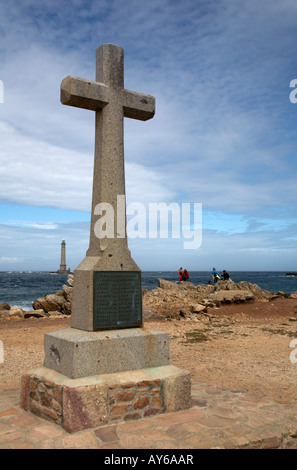 Cross and lighthouse at Cap de la Hague, Goury, on the Cotentin Western Coast, La Manche, France Stock Photo