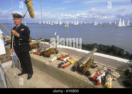 Cowes Sailing Regatta races are started when the small cannons are fired by race officer known as the Gunner. Cowes, Isle of Wight, Hampshire 1980s UK Stock Photo