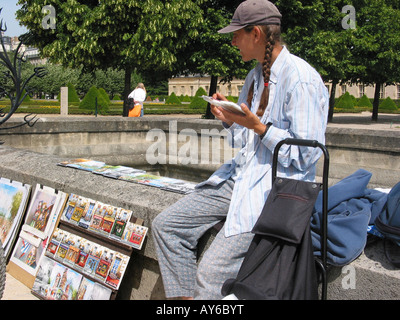 street artist selling homemade paintings near Dome des Invalides Paris France Stock Photo