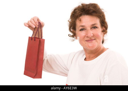 Old woman with presents paper bag Stock Photo