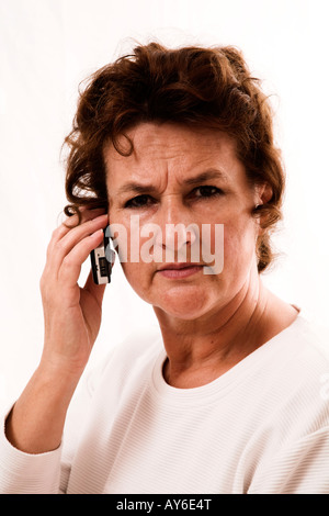 Old woman with telephone Stock Photo