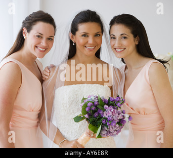Portrait of Hispanic bride and bridesmaids Stock Photo