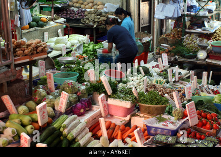 Street Food Market in Hong Kong - Traders Selling Vegtables [Graham Street Market, Graham Street, Hong Kong, China, Asia].     . Stock Photo