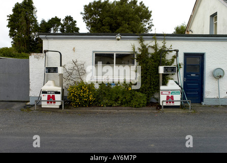 Petrol pumps outside a house in Butlerstown Co Waterford Ireland Stock Photo