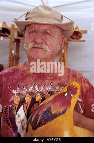 MR 558 Gourd artist Robert Fern displays a rooster creation, at the annual Mayfair celebration in Cloudcroft, New Mexico. Stock Photo