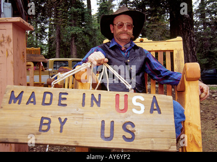 MR 563 Woodworker Bill Shrecengost displays a sign indicating where his hand-crafted furniture is made - Cloudcroft, New Mexico. Stock Photo