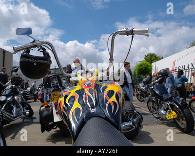 Custom built Harley Davidson motorcycle with flame paint job and super high apehanger handlebars photographed at an event Stock Photo