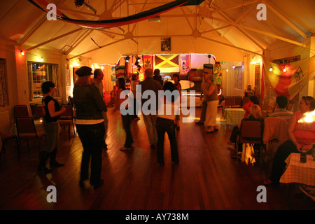 People dance in a decorated Suffolk village hall Stock Photo