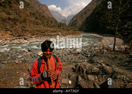 boy with a flute near Kali Gandaki river in  Tatopani Nepal asia Stock Photo