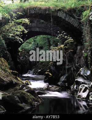 The ancient Roman bridge across the Machno at Penmachno near Betws y Coed North Wales Stock Photo