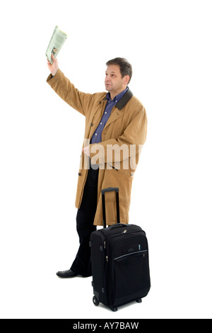 Man in brown jacket with black suitcase Stock Photo