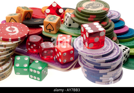 poker dice gambling chips and dice on white perspex Stock Photo