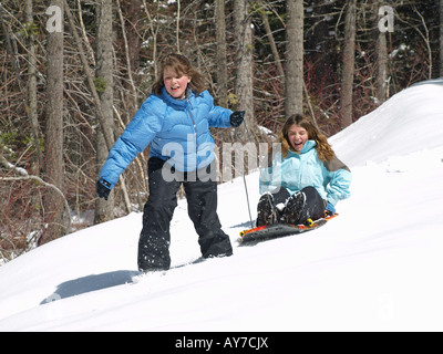 Two teenagers enjoy a fresh winter snow at Suttle Lake Resort in the Cascade Mountains Stock Photo