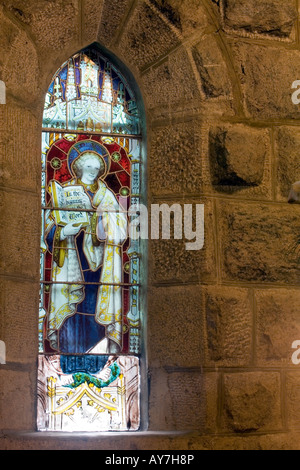 Stained glass window in Protestant Christ Church built of stone by Britishers in 1910 Munnar Hill Station Idduki Kerala India Stock Photo