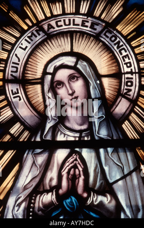 Stained Glass in Church Representing Virgin Mary Stock Photo