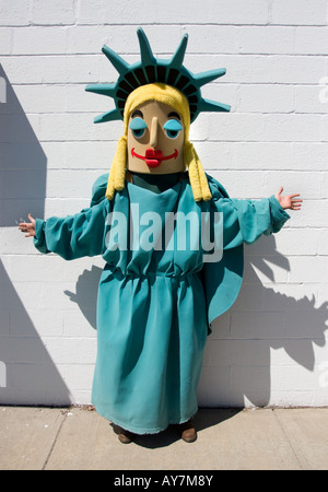 A man dressed as a funny version of the Statue of liberty promotes a tax accountant service in West Haven Connecticut USA Stock Photo