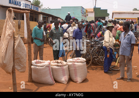 Men buying beans in a Malawian market scene. Stock Photo