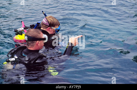 A diving instructor supervises a student during scuba school, at the Blue Hole in Santa Rosa, New Mexico. Stock Photo