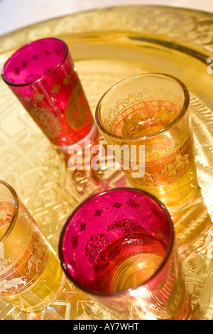 Oriental colored tea glasses on golden plate Stock Photo