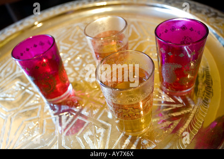 Oriental colored tea glasses on golden plate Stock Photo