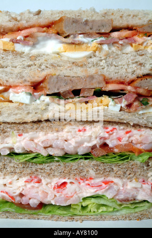 Sandwiches filled with prawn lettuce sausage egg and bacon Stock Photo