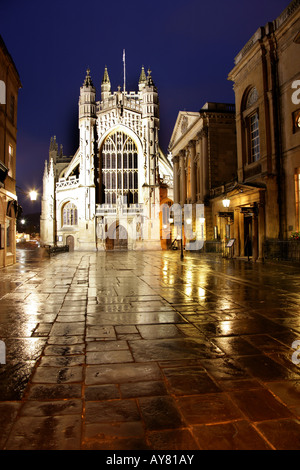 City of Bath England Night photograph of the main entrance to Bath Abbey from Abbey Churchyard with the Roman Baths on the right Stock Photo