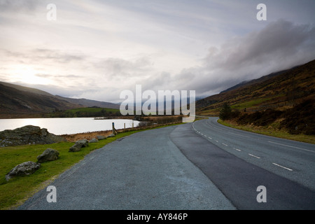 Empty Lonely road winding through Snowdonia Wales UK Stock Photo