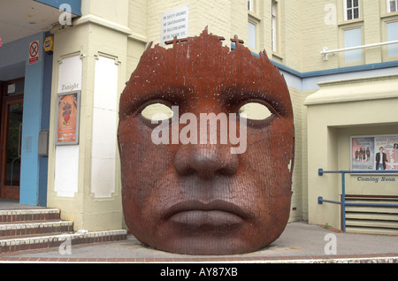 Rusting sculpture depicting a face outside the Marlowe theatre, Canterbury, Kent. Stock Photo