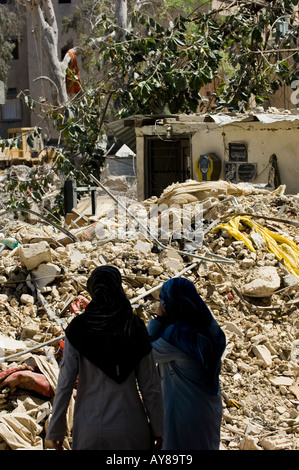 two women looking at the destroyed building Stock Photo