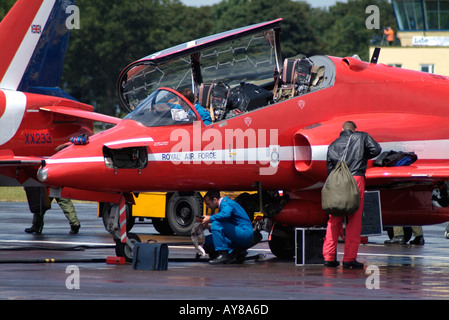 Mechanics working on a Red Arrows Hawk Jet Stock Photo