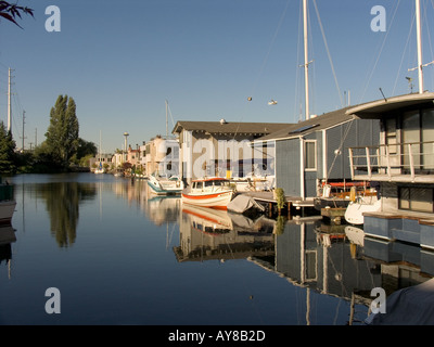 Houseboat community on east side of Lake Union with Space Needle in distance Seattle Washington Stock Photo