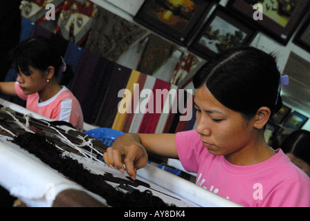 Young female workers doing embroidery Hanoi Vietnam Stock Photo