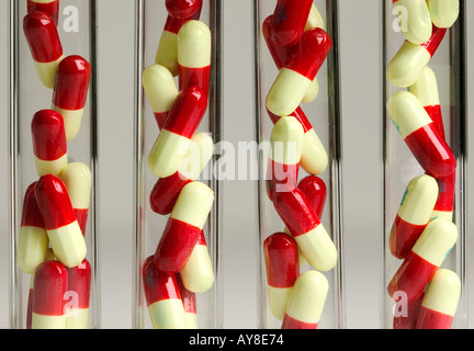 Pills displayed in test tubes Stock Photo