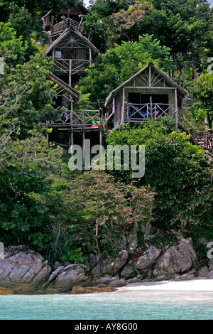 Wooden hillside bungalows on stilts at View Point Ko Lipe island Thailand Stock Photo