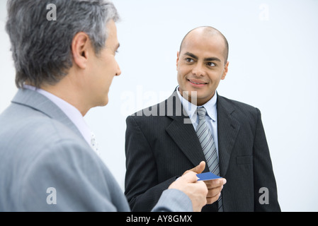 Two businessmen exchanging business card Stock Photo