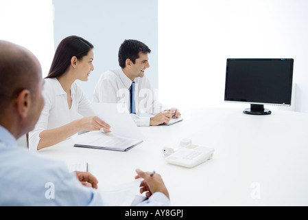 Group of executives having teleconference Stock Photo