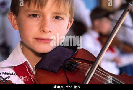 One of the 'New Mexico Fiddle Kids' at the Lincoln County Cowboy Symposium, in Ruidoso Downs, New Mexico. Stock Photo