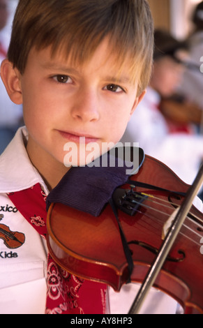 One of the 'New Mexico Fiddle Kids' at the Lincoln County Cowboy Symposium, in Ruidoso Downs,  New Mexico. Stock Photo