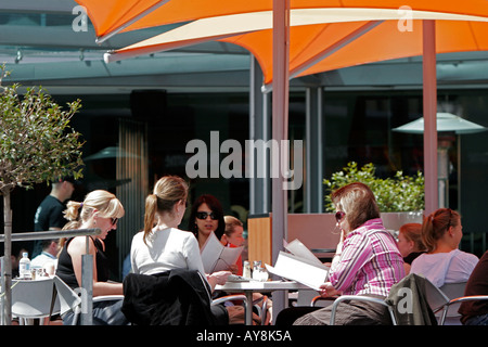 Young women dining outside Federation Square Melbourne Victoria Australia Stock Photo