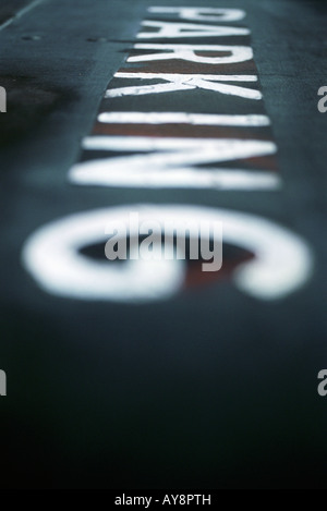 Close-up of the word "parking" on pavement, selective focus Stock Photo