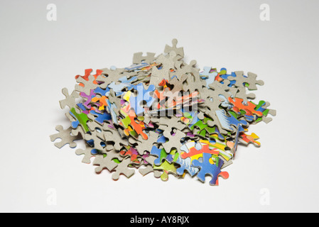 Jigsaw puzzle pieces in a pile, close-up Stock Photo